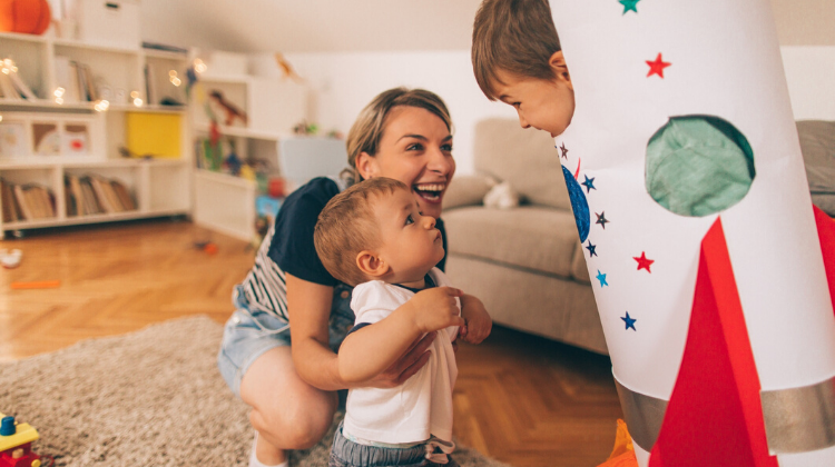 Babysitter playing with two children
