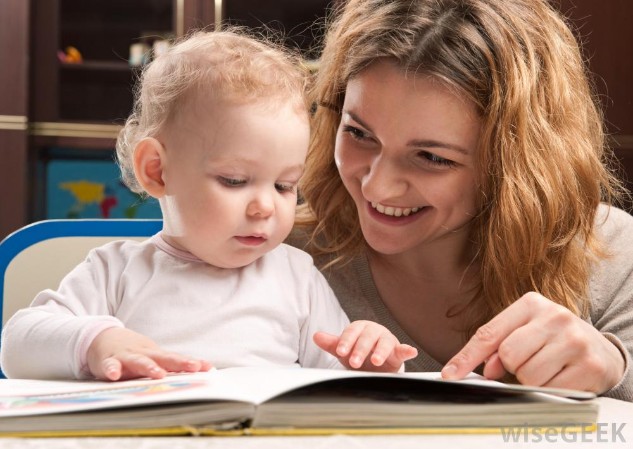 http://images.wisegeek.com/mother-and-baby-looking-at-book.jpg